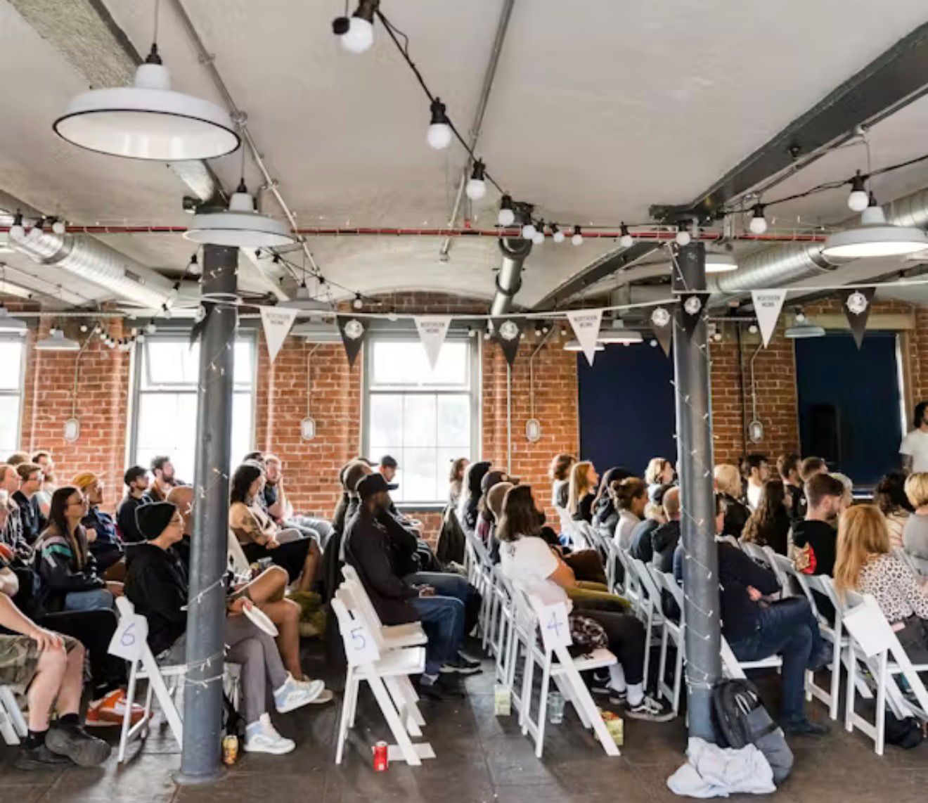 Audience seated during a live conference session