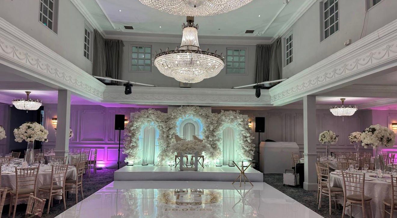 Elegant hall with floral stage and chandeliers