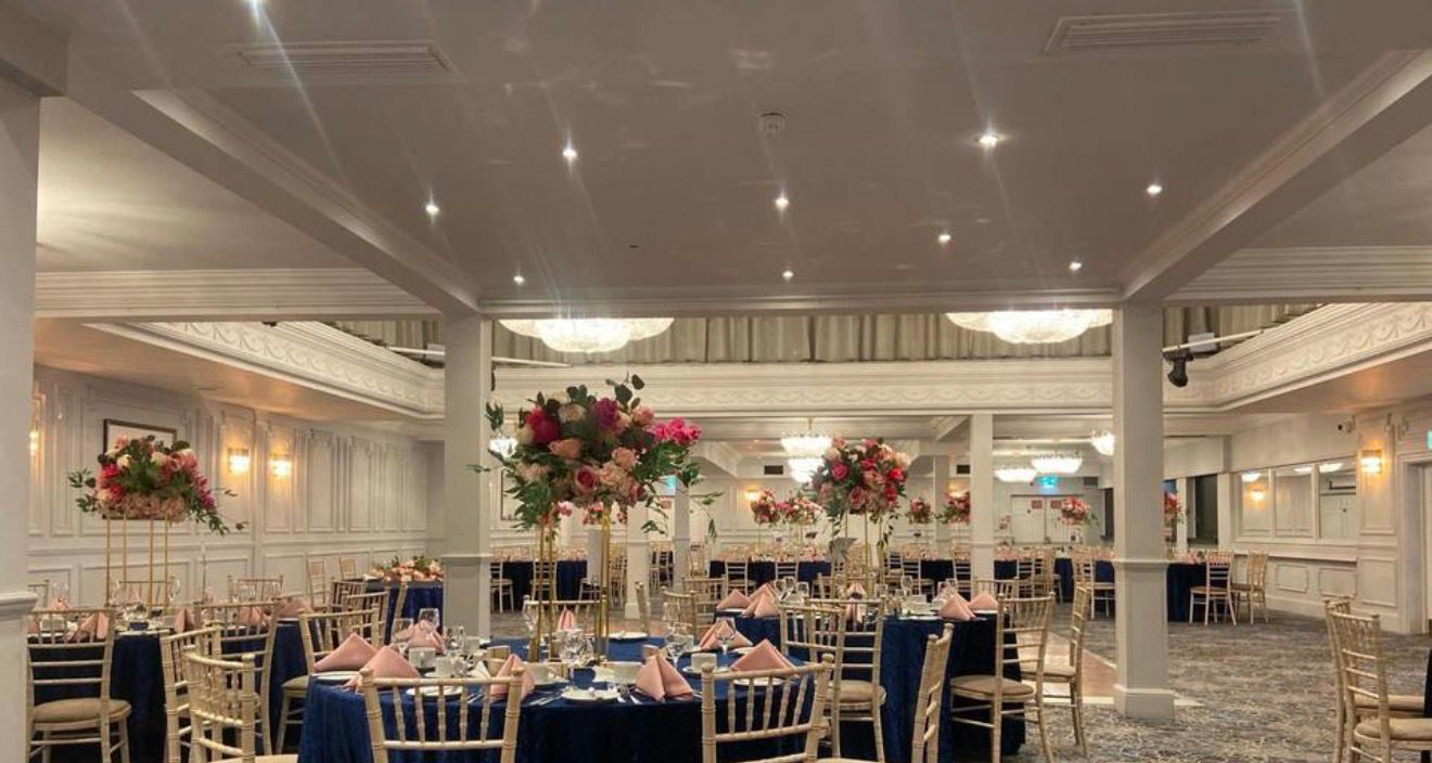 Formal reception room with styled round dining tables