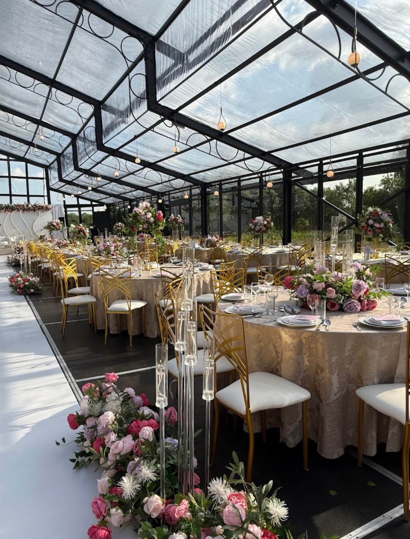 Glass marquee prepared for a floral celebration