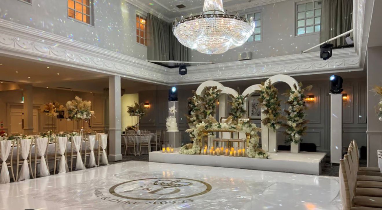 Luxury ballroom with dance floor and floral stage